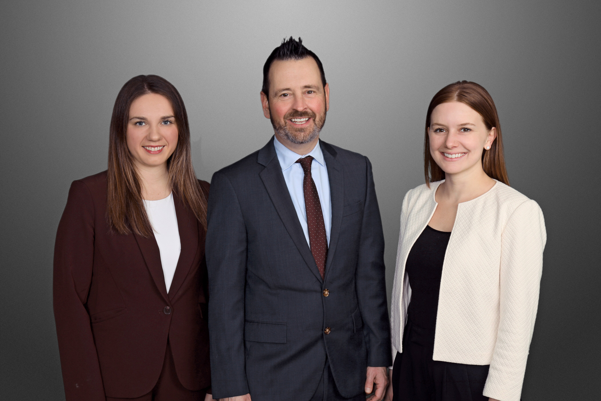Family Law Group Photo. From left to right: Attorney Kaitlyn Smearcheck, Attorney Thomas Clark, and Attorney Alexandria Ebbert.